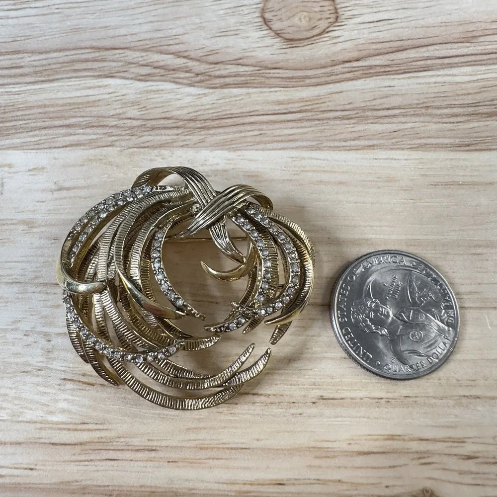 Vintage Monet Gold Tone Etched Swirl Rhinestone Brooch Signed BEAUTY